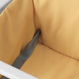 A yellow padded seat cover designed for the LANGUR high chair, providing comfort and easy cleaning.