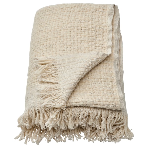 Off-white handwoven throw with fringes. Half cotton, half wool; warm and cozy.