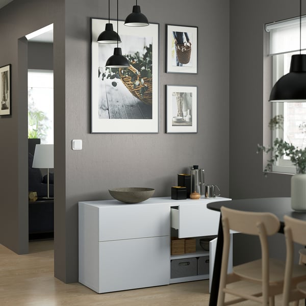 Interior room with LAPPVIKEN storage cabinet displaying art, lights, and decor.