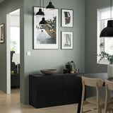 Modern living room with LAPPVIKEN black-brown cabinet, sleek design, wooden look, and hanging art.