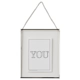 Clear-framed photo holder with chain, displaying you artwork in black. Sleek, square design with minimalist style.