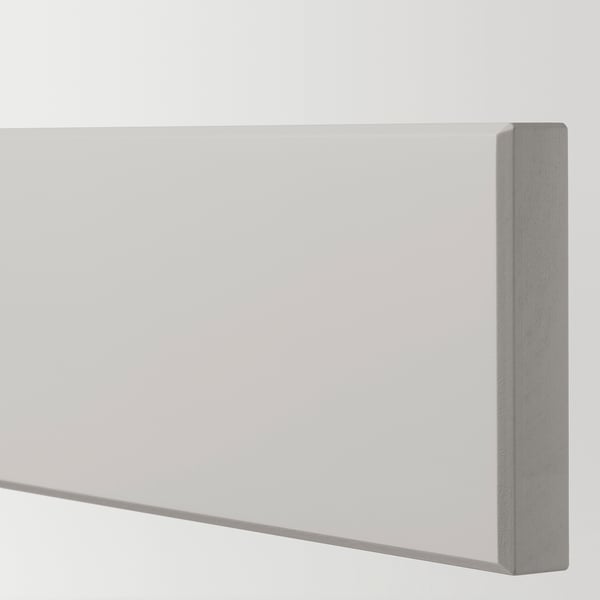 Close-up of sleek, grey kitchen cabinet with smooth, bevelled edges.