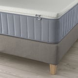 Ikea LILLFJÄLLET bed with cushioned headboard, upholstered sides, and wooden legs.