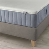 IKEA LILLFJÄLLET bed with cushioned headboard and tailored mattress support.