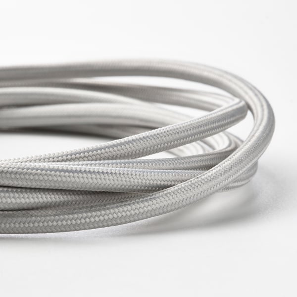 Close-up of tangled silver usb cables, showing dense knit and flexible material.