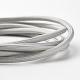 Close-up of tangled silver usb cables, showing dense knit and flexible material.