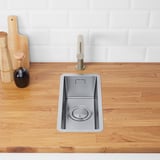 Modern kitchen sink with magnetic stainless steel lid.