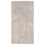 A rectangular, beige LINDKNUD rug. Made from recycled polyester, it has a soft, plush surface ideal for bedrooms.