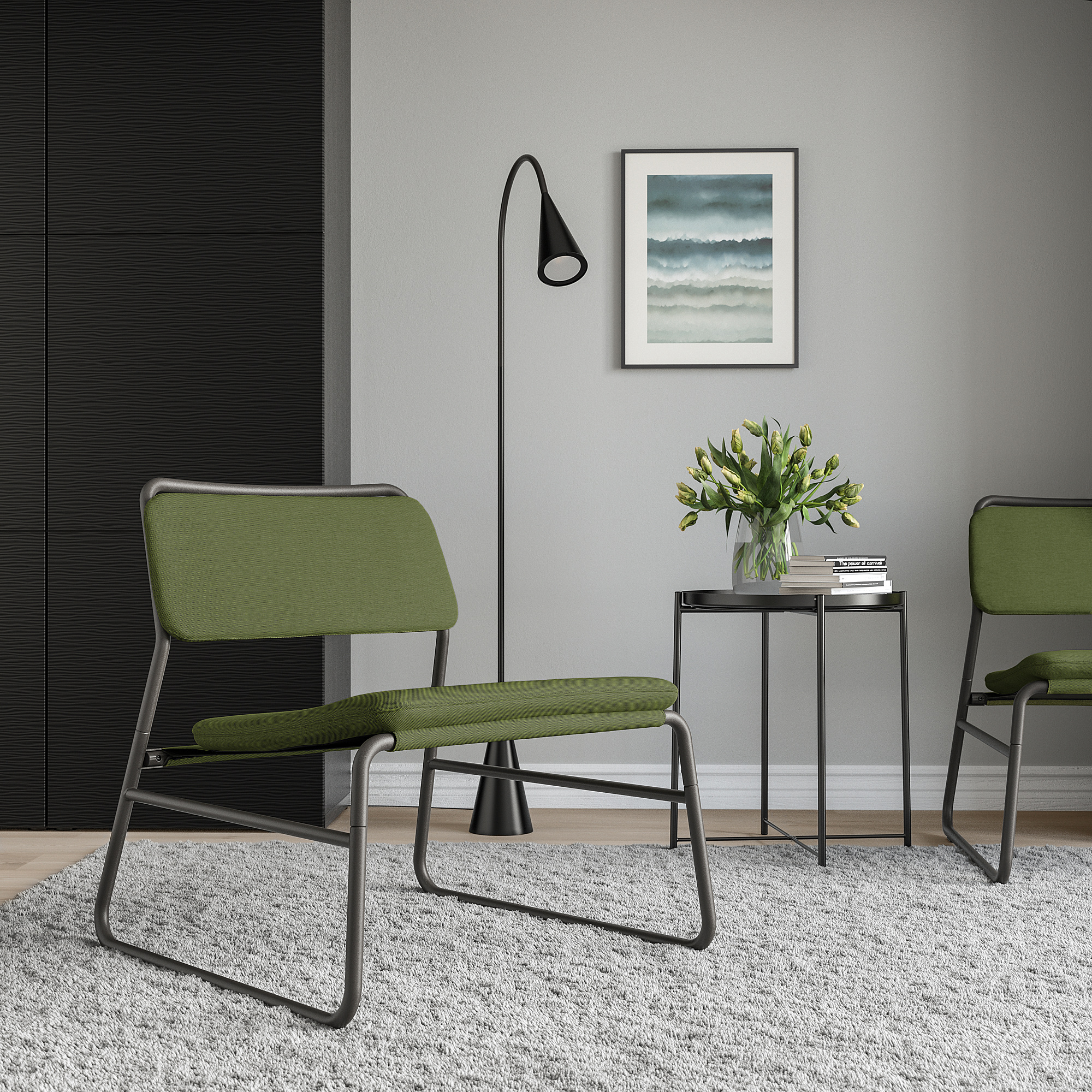 Two green LINNEBÄCK chairs on white rug, black side table with flowers and books.