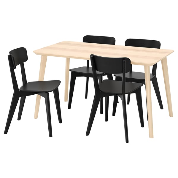 Ikeas LISABO set a light wooden table and dark chairs, evoking a cozy, natural feel. Award-winning design, durable, and sturdy.