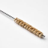 Small, high-quality cleaning brush with bristles and a twisted stainless steel handle.
