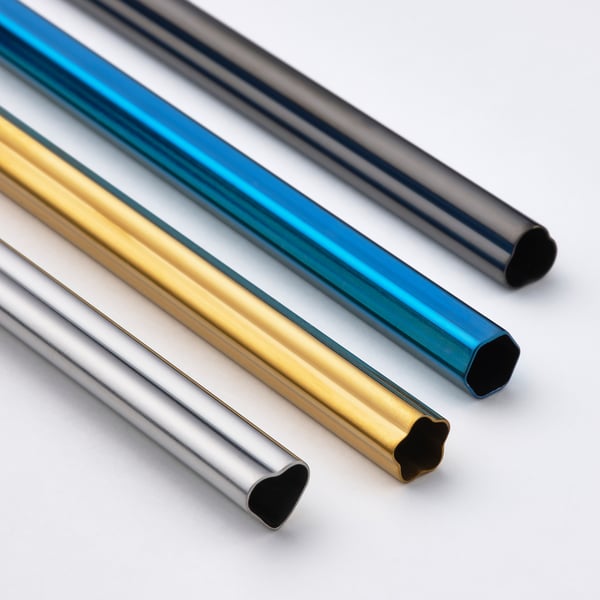 Four metallic straws in gold, blue, black, and silver, arranged diagonally, showcasing their smooth, reflective surfaces and sturdy construction.