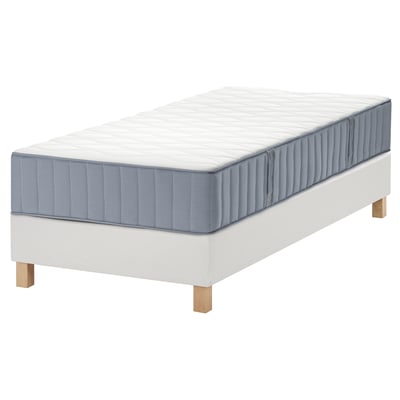 This image shows a white LYNGÖR bed base with a gray vågstranda mattress, featuring pocket springs and 7 comfort zones for ergonomic support.