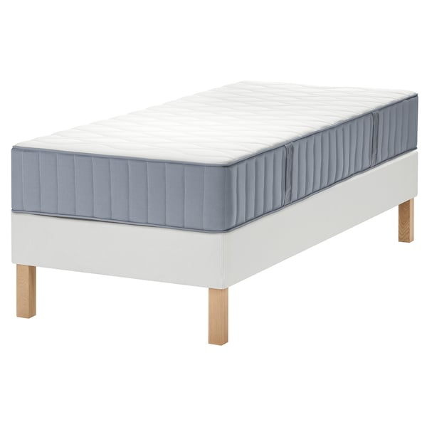 LYNGÖR mattress set on white base with oak legs.