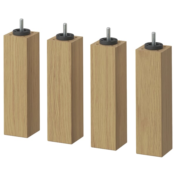 Four light-colored wooden legs with adjustable screws and black metal fixtures.