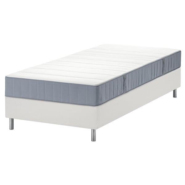 White LYNGÖR bed frame with grey mattress, featuring pocket springs and flat slats.