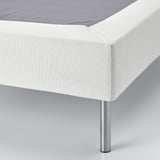 Modern bed base with clean, upholstered design and sturdy metal legs.