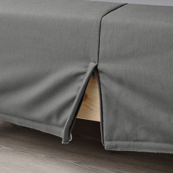 Close-up of LYNGÖR bed base with smooth fabric and visible zipper showing mattress support.