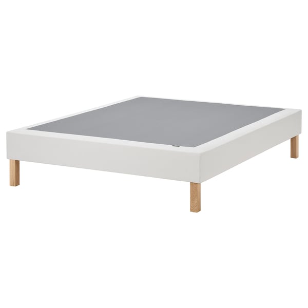 White flat-pack bed base, oak legs, upholstered top.