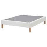 White flat-pack bed base, oak legs, upholstered top.