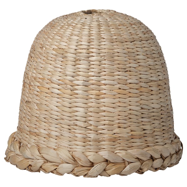 Handwoven beige lampshade, bell-shaped, braided banana fibers, soft glow.