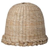 Handwoven beige lampshade, bell-shaped, braided banana fibers, soft glow.