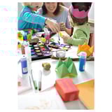 Kids crafting with paints & origami under adults guidance.