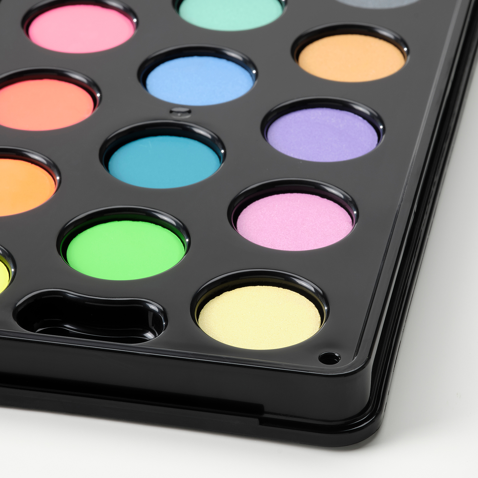 Set of vibrant watercolors in secure plastic case.