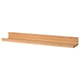 Option: A MÅLERÅS wooden shelf in light brown. Its long, rectangular, and a groove to display photos or artwork.