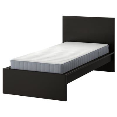 Modern black bed, high headboard.