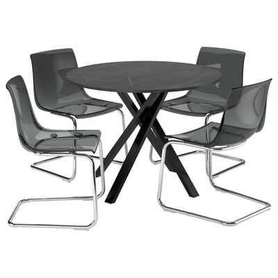 A MARIEDAMM dining set with four black chairs and a dark round table.