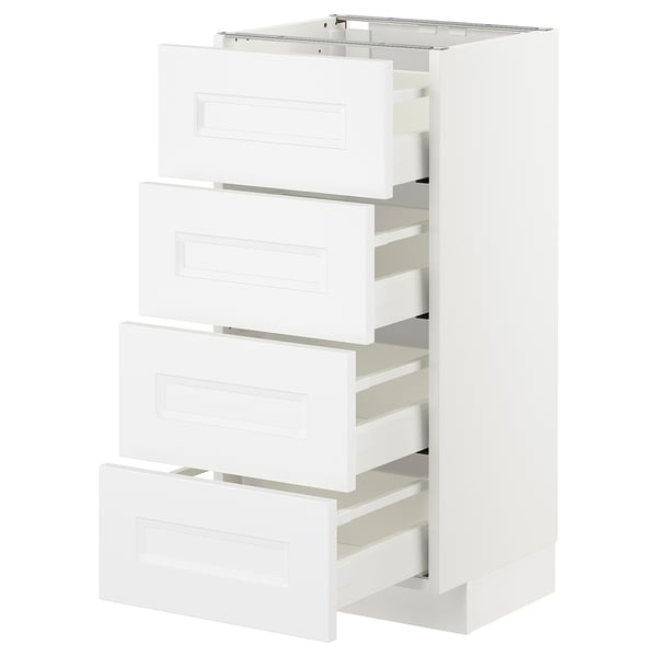 A white METOD kitchen cabinet with four drawers, each partially open, featuring a clean, modern design.