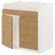 A white and light wood kitchen cabinet unit with a minimalist design and integrated handles.