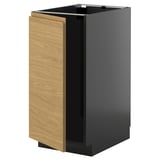 A METOD kitchen cabinet with a black and wood design, featuring a modern minimalist look.