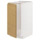 A white METOD kitchen cabinet with a light oak side panel and minimalist design.
