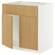 A METOD kitchen cabinet in light oak finish. It is a tall unit with a frame construction and hinged doors.