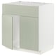 A light green METOD kitchen cabinet with a classic design, featuring two doors and a sturdy frame, perfect for a harmonious kitchen look.