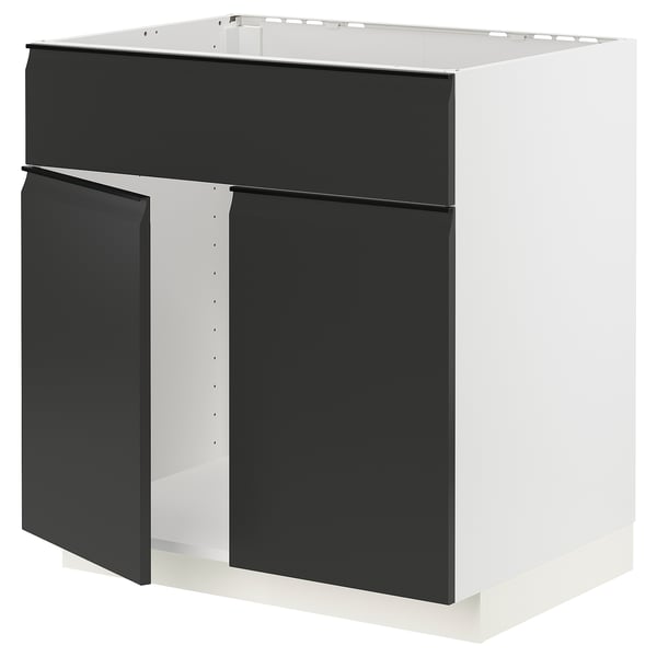 Modern black and white METOD kitchen unit with integrated handles and clean, minimalist design.