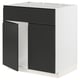 Modern black and white METOD kitchen unit with integrated handles and clean, minimalist design.