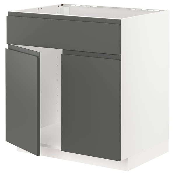 Modern grey kitchen unit with sleek, dark panels and white framework.