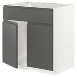 Modern grey kitchen unit with sleek, dark panels and white framework.