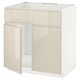 Modern beige METOD kitchen unit with high gloss finish and integrated handles.