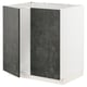 A white METOD kitchen cabinet with dark grey kalhyttan doors, featuring a modern and urban design.