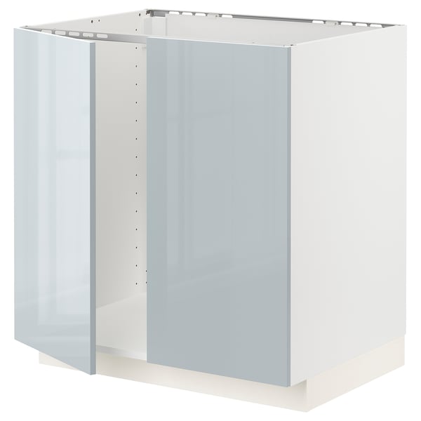 A white METOD kitchen cabinet with a modern design, featuring a glass door and polished edges, perfect for a stylish kitchen setup.