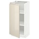 High gloss beige METOD kitchen cabinet with one open door, sleek handles, and adjustable shelves.