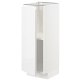 A white METOD kitchen cabinet with a sleek, modern design and a high gloss finish. It adjustable shelves and a minimalist, handle-less door.