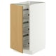 A white METOD kitchen cabinet with a wooden door and wire shelves. The door is open, revealing the interior storage.
