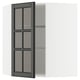 Modern black kitchen cabinet with glass doors, adjustable shelves.
