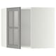 Modern grey glass cabinet door with beveled edges.