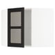 A black stained glass cabinet door, part of the METOD kitchen system. It a traditional character with beveled edges.
